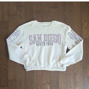Primark beige cropped sweater with text print size 12-13